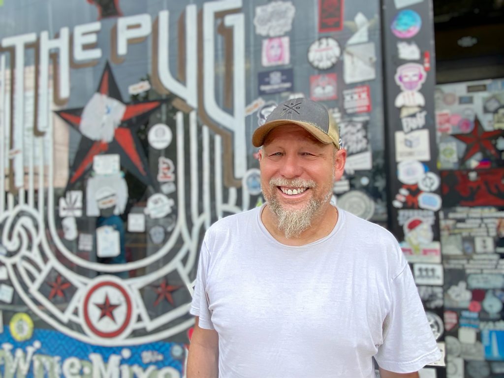 Photo: Tony Tomelden outside The Pug (1236 H St. NE), the bar he opened in 2007. E. O’Gorek/CCN